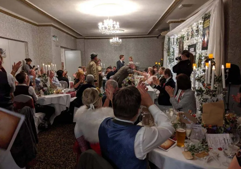 Group celebrating at a murder mystery party